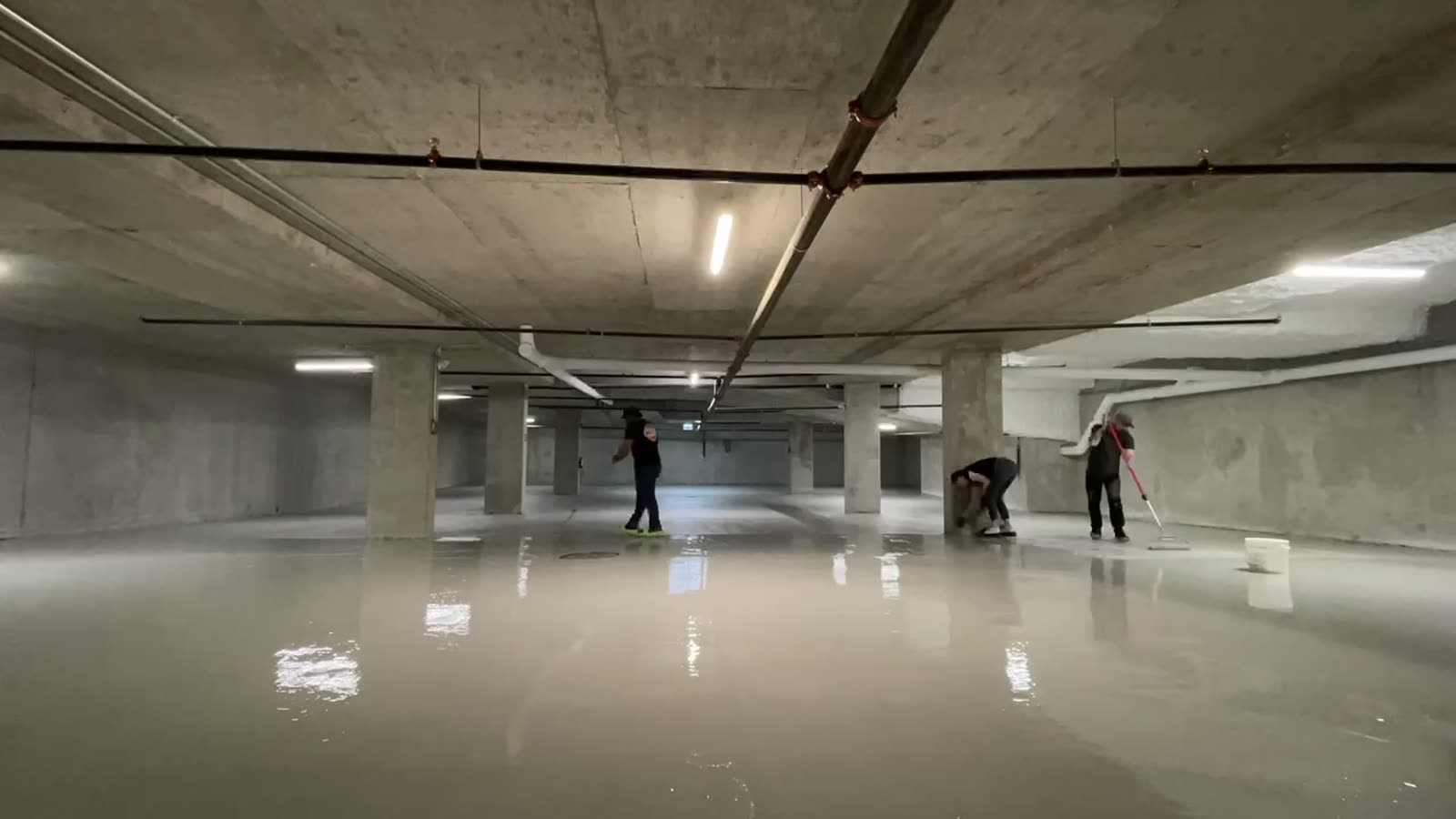 Sweeping view of a high-gloss epoxy floor installed by Becker Flooring
