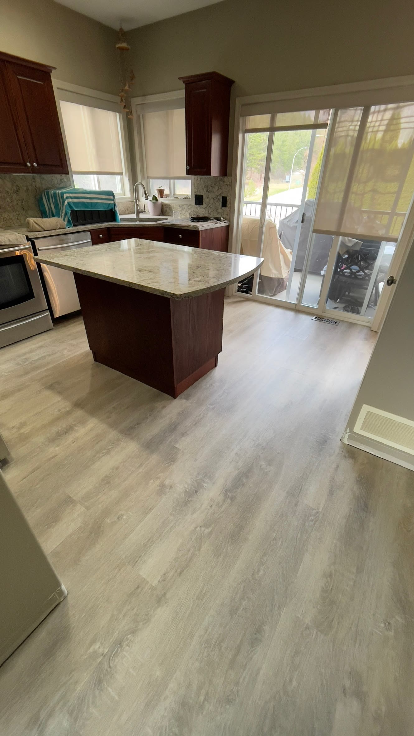 Hardwood flooring in a bright kitchen with island